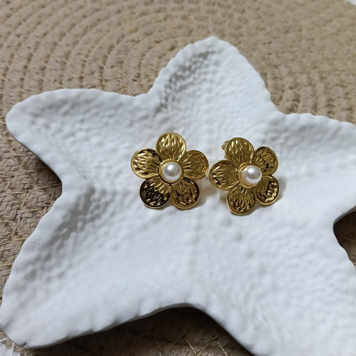 Gold flower-shaped earrings with pearl centers