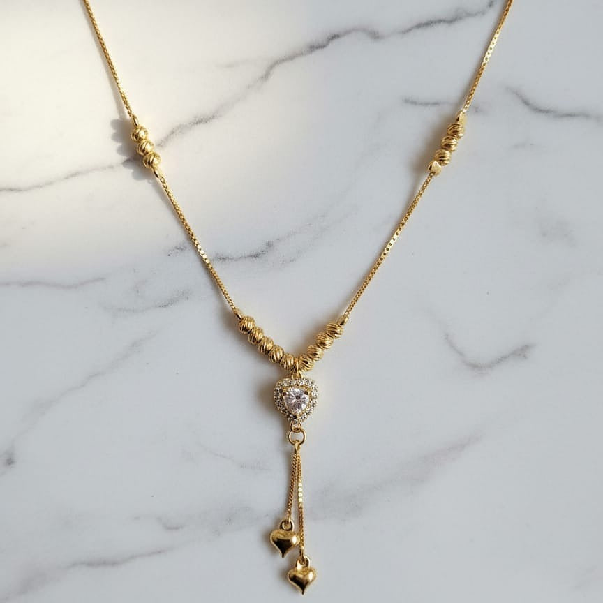 Gold necklace with a heart pendant