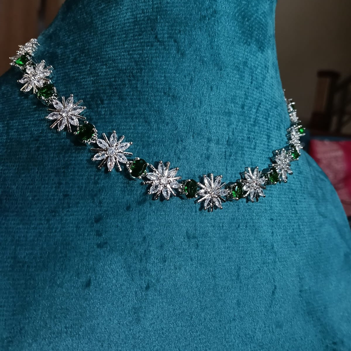 Necklace with star-shaped green and clear stones