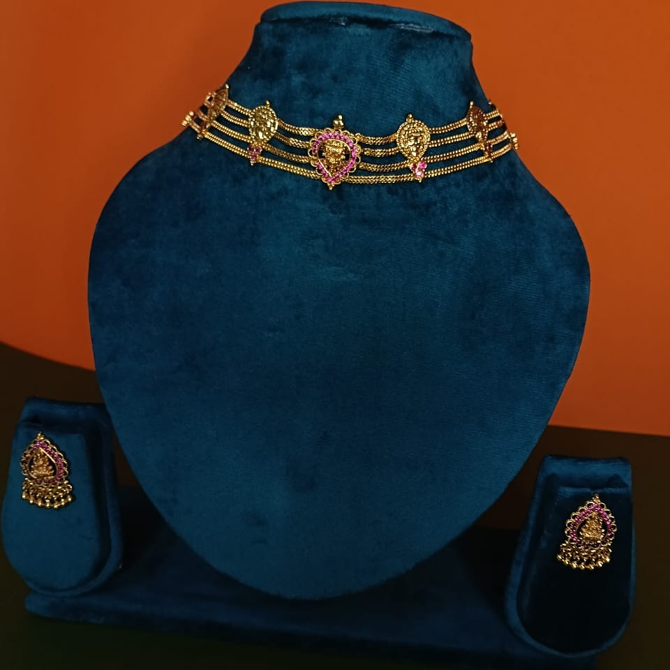 Gold necklace with pink stones 