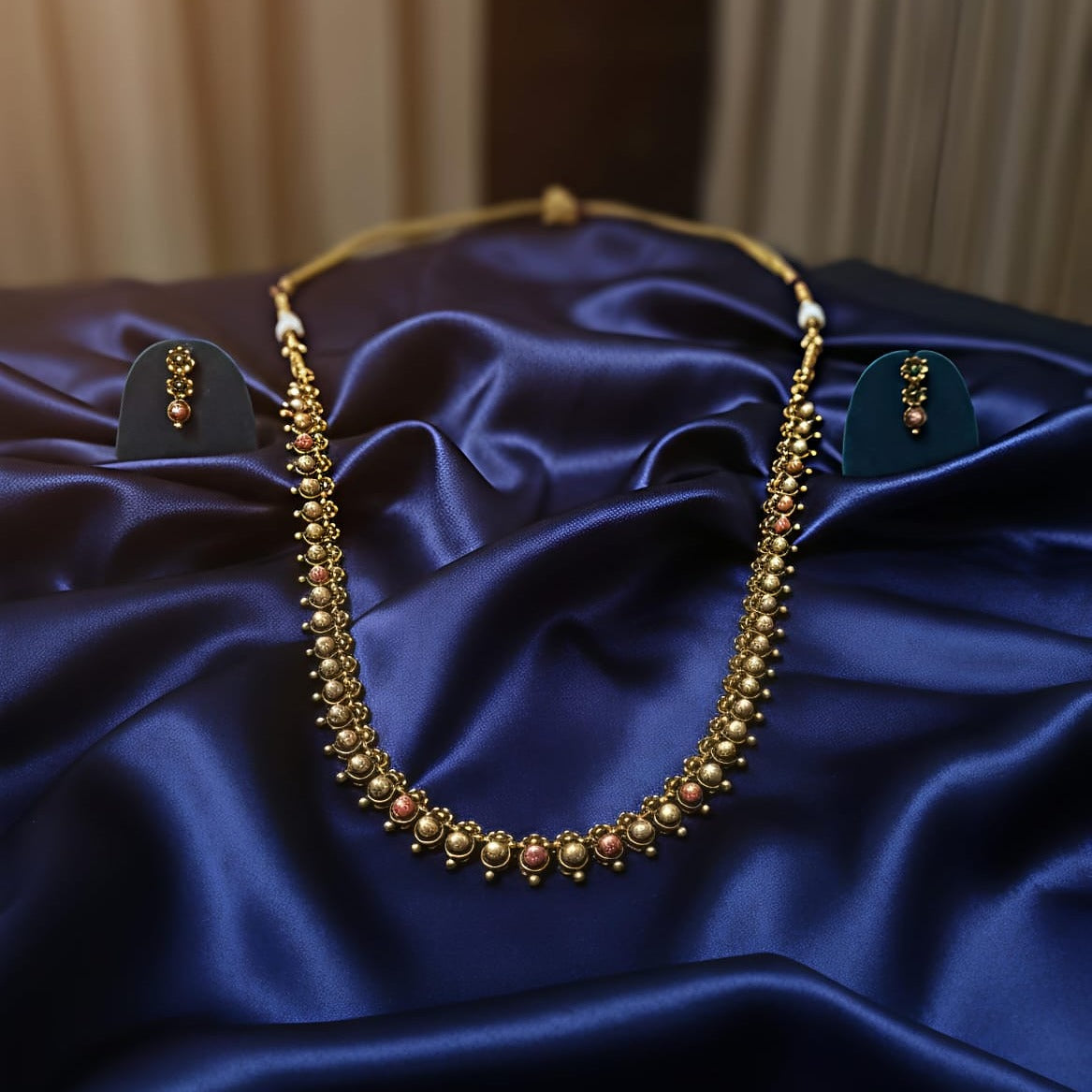 Regal Antique Gold Long Hara with Ruby Accents