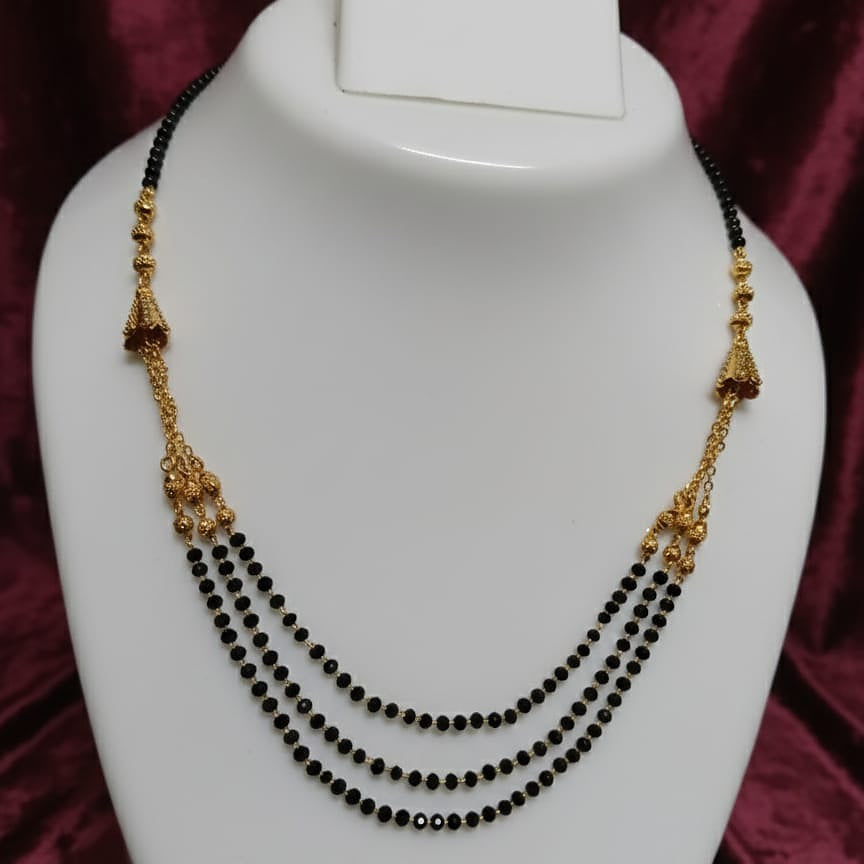 Traditional Gold and Black Beaded Necklace