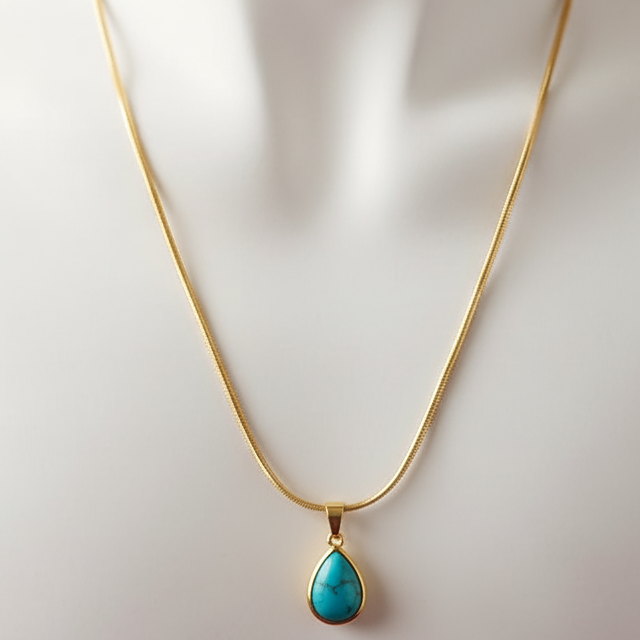 Gold necklace with a turquoise pendant  