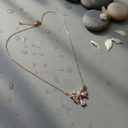 Rose gold necklace with a bow pendant 