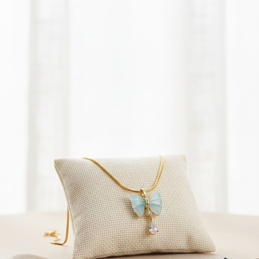 Gold necklace with a butterfly pendant  