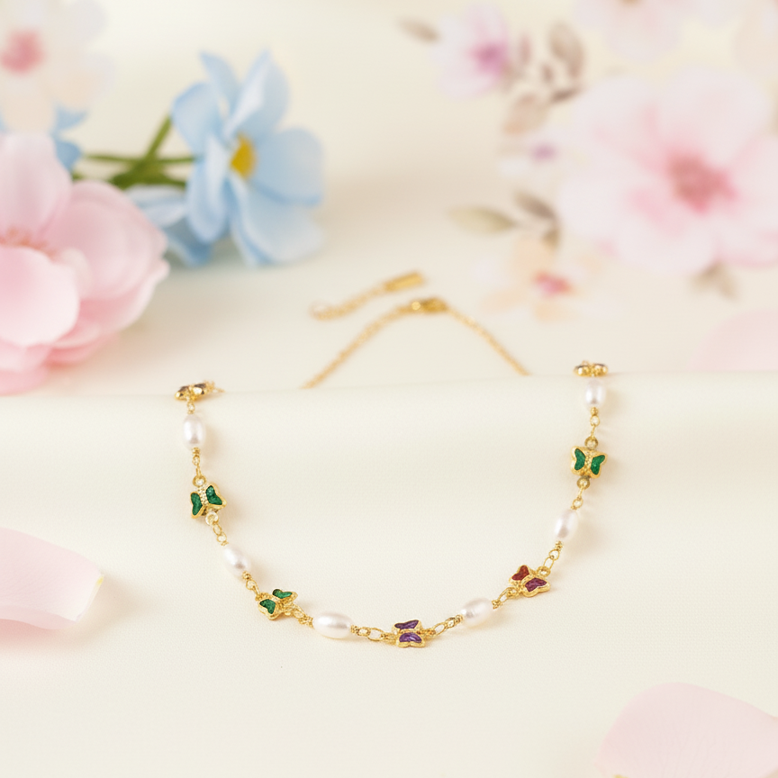 Gold bracelet with floral designs on a soft floral background