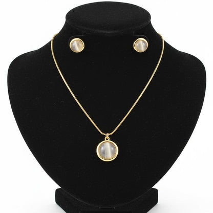 Jewelry set with necklace and earrings on a black stand