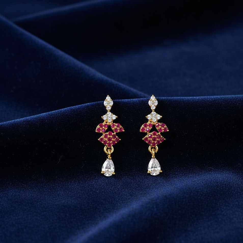 Pair of earrings with red gemstones and clear stones 