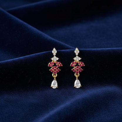 Pair of earrings with red gemstones and clear stones 