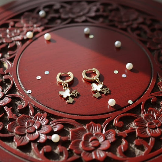 Gold earrings with butterfly charms 