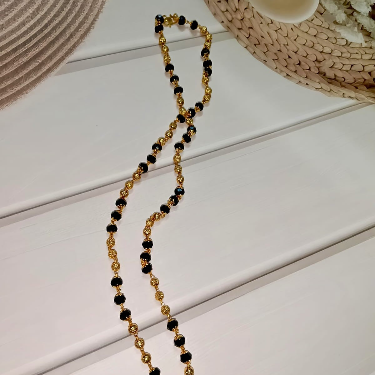 Gold and black beaded necklace