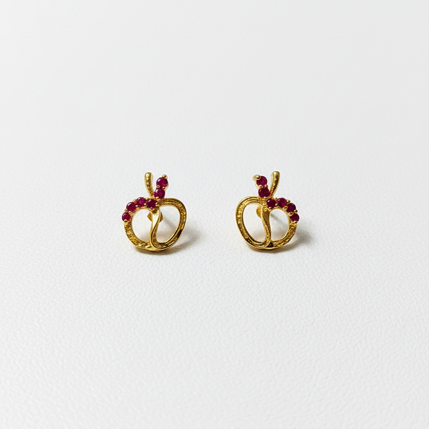 Gold earrings with red gemstones 