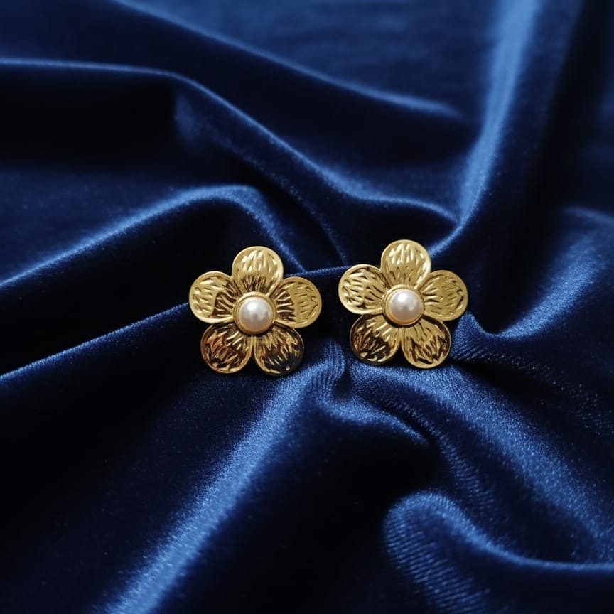 Gold flower-shaped earrings with pearl centers 