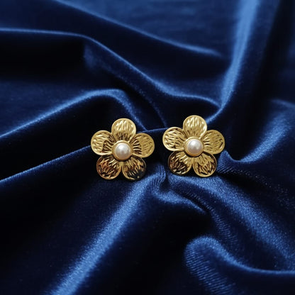 Gold flower-shaped earrings with pearl centers 