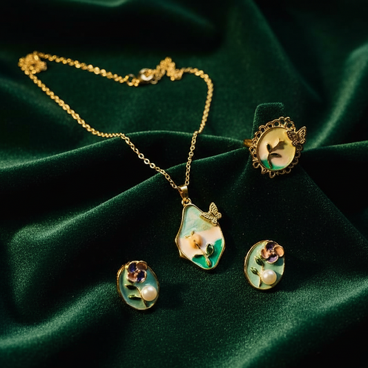 Gold necklace and earrings with floral designs