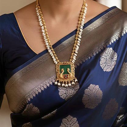 Gold necklace and earrings with peacock design