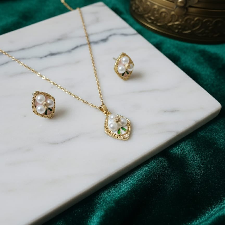 Gold necklace and earrings with pearl accents 