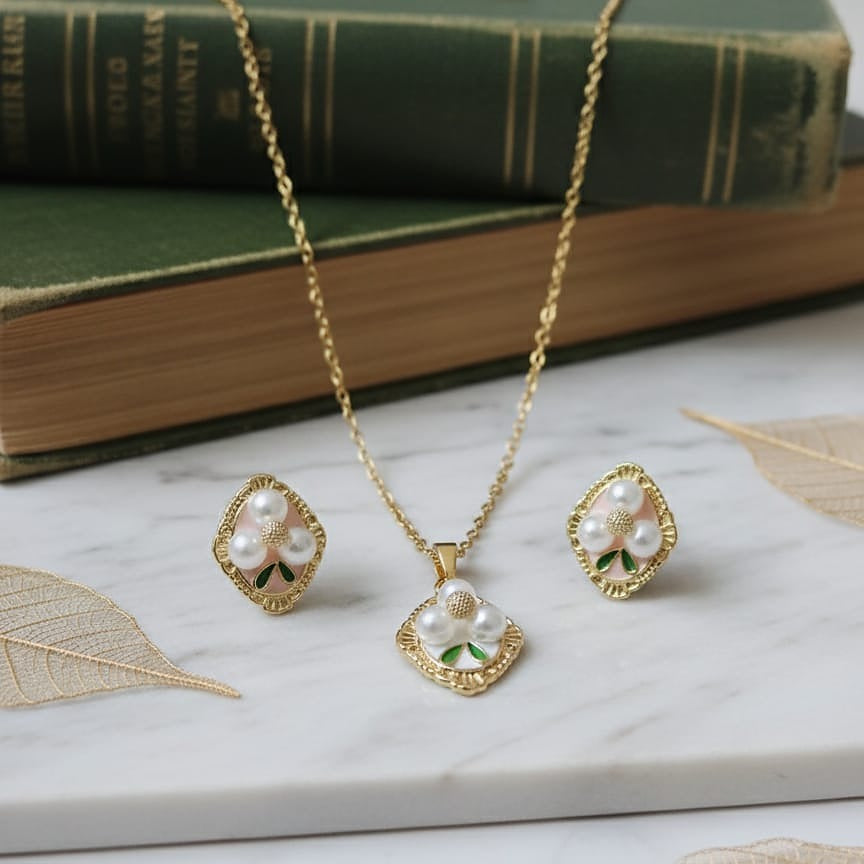 Gold necklace and earrings with pearl stone