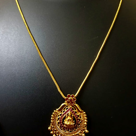 Gold necklace with a detailed pendant 