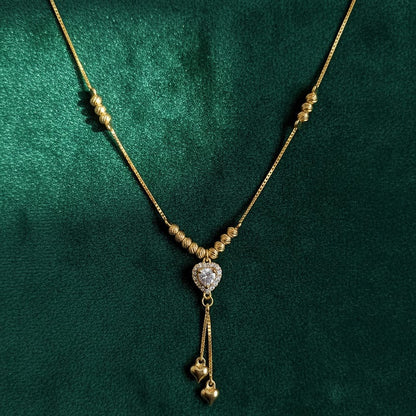 Gold necklace with a heart-shaped pendant 