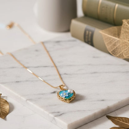 Gold necklace with a heart-shaped pendant 