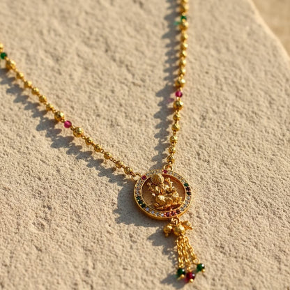 Gold necklace with a pendant 