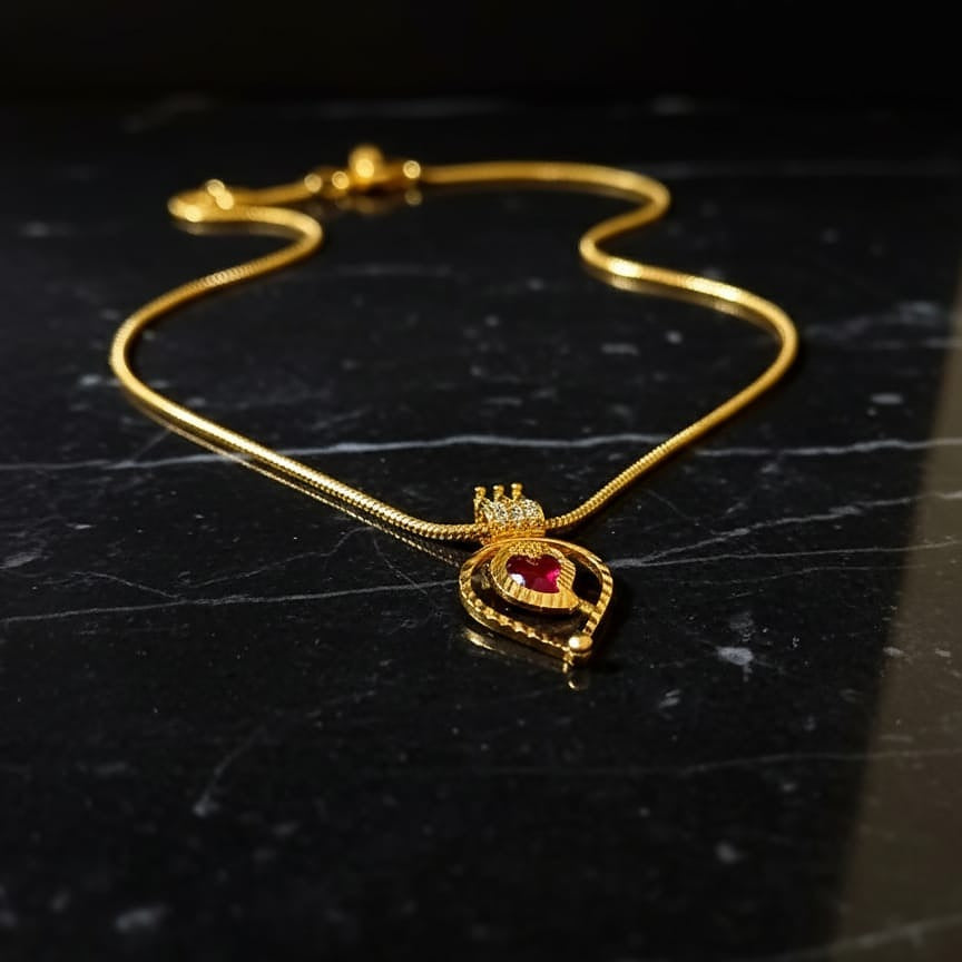 Gold bracelet with a heart-shaped pendant
