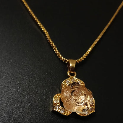 Gold necklace with a rose-shaped pendant 