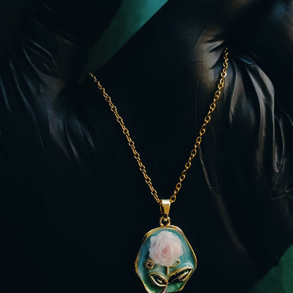 Gold necklace with a rose pendant 