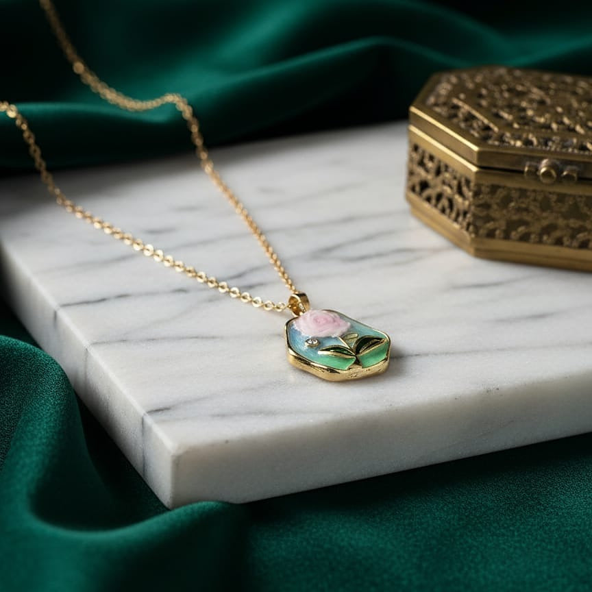 Gold necklace with a rose pendant 