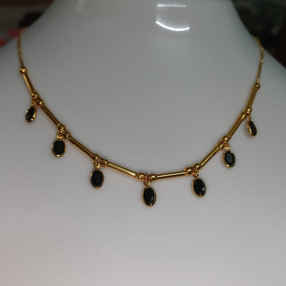 Gold necklace with black stones 