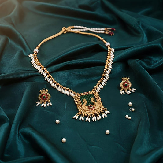 Gold necklace with peacock design