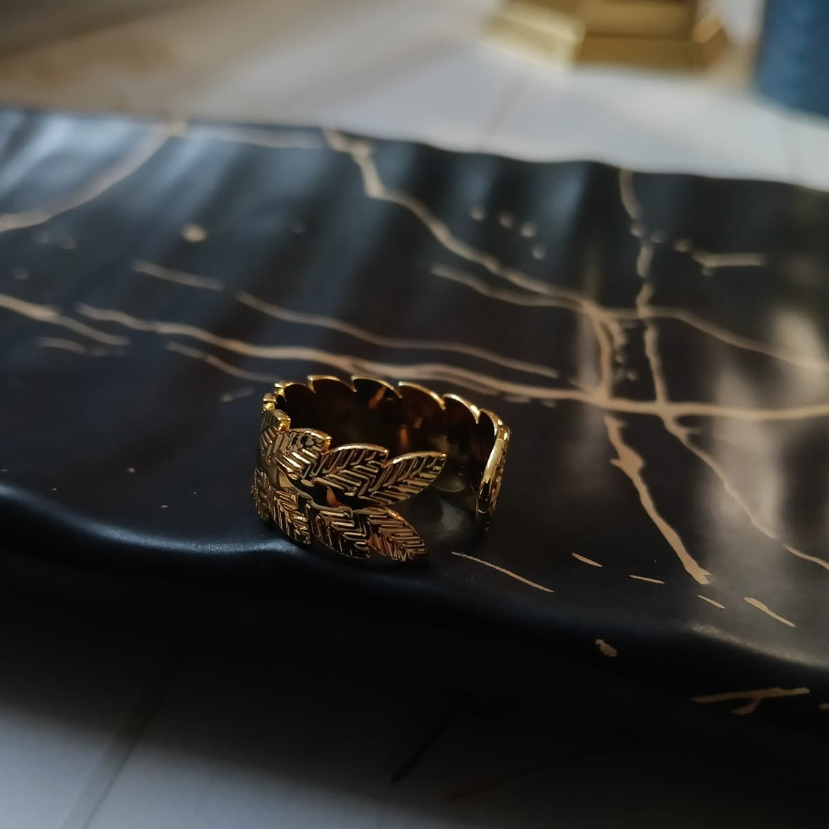 Gold ring with leaf design 