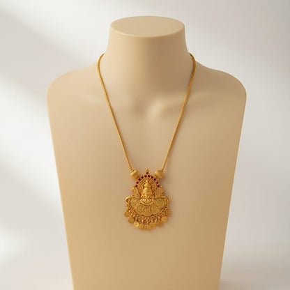 Gold necklace with a detailed pendant