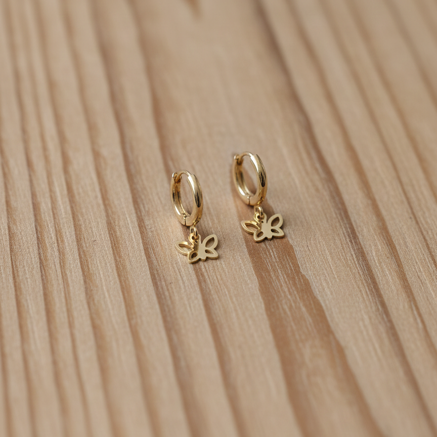 Gold hoop earrings with butterfly charms 