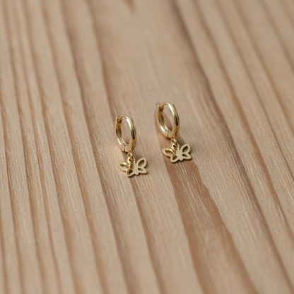 Gold hoop earrings with butterfly charms 