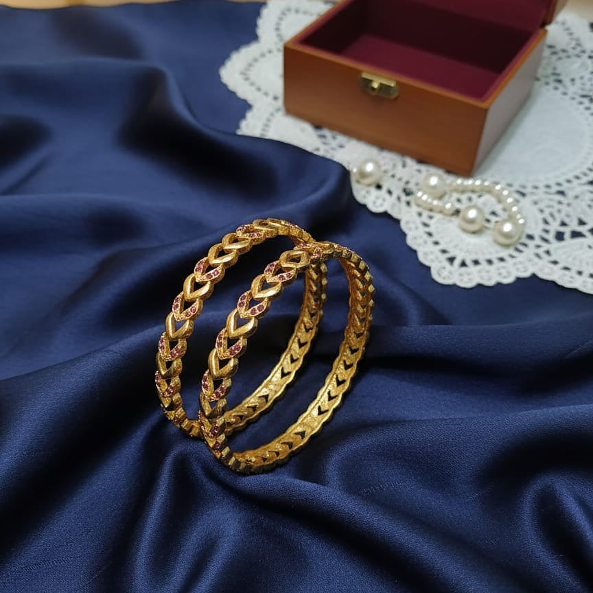 Intricately Carved Gold-Toned Bangle Set with Red/Ruby Accent Stones