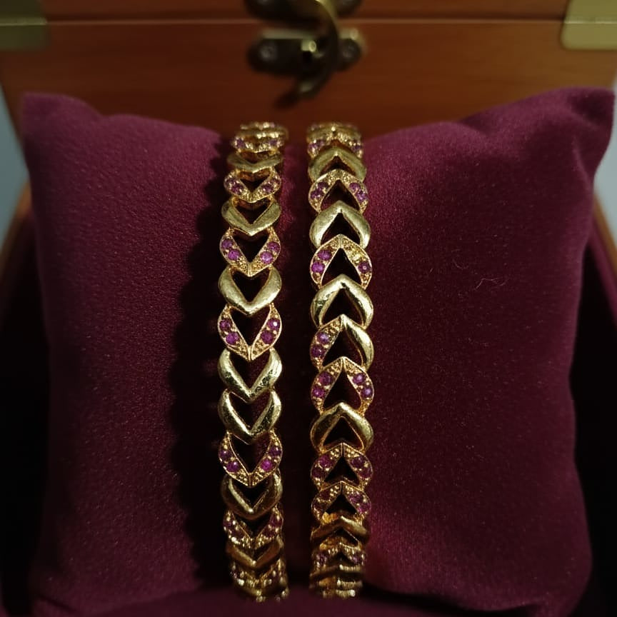 Intricately Carved Gold-Toned Bangle Set with Red/Ruby Accent Stones
