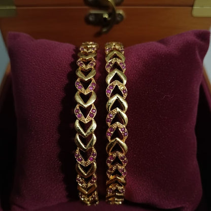Intricately Carved Gold-Toned Bangle Set with Red/Ruby Accent Stones