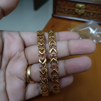 Intricately Carved Gold-Toned Bangle Set with Red/Ruby Accent Stones