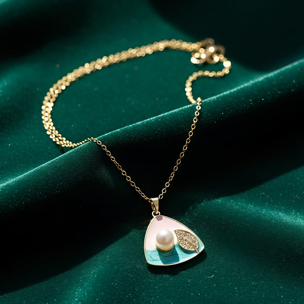Gold necklace with a pendant featuring a pearl 