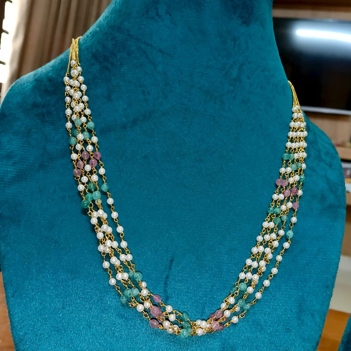 Multistrand necklace with pearls and gemstones