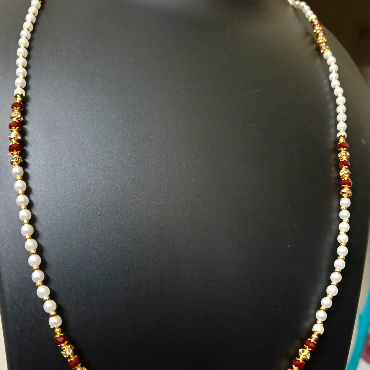 Necklace with pearls and red and gold beads
