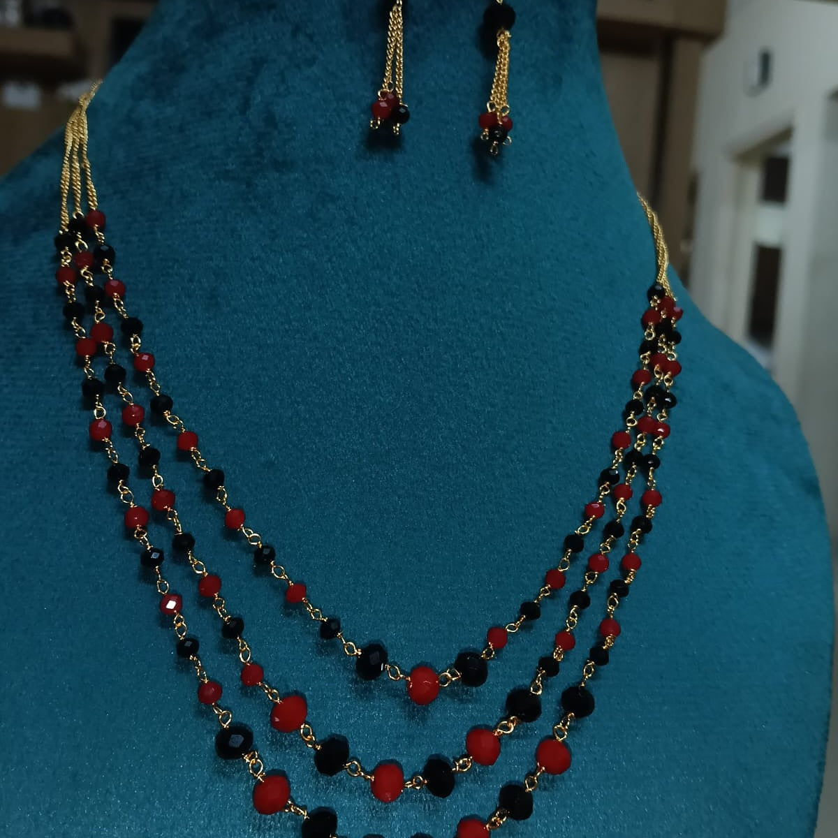 Necklace with red and black beads