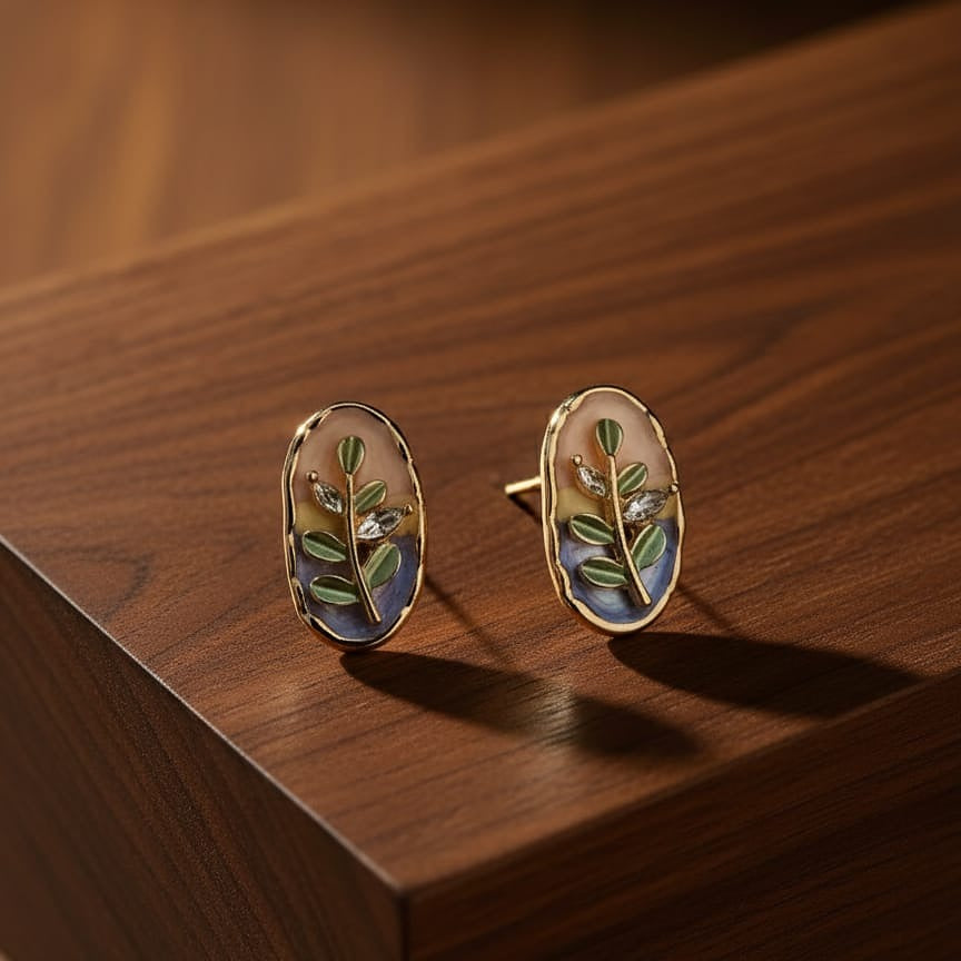 Pair of gold earrings with leaf design