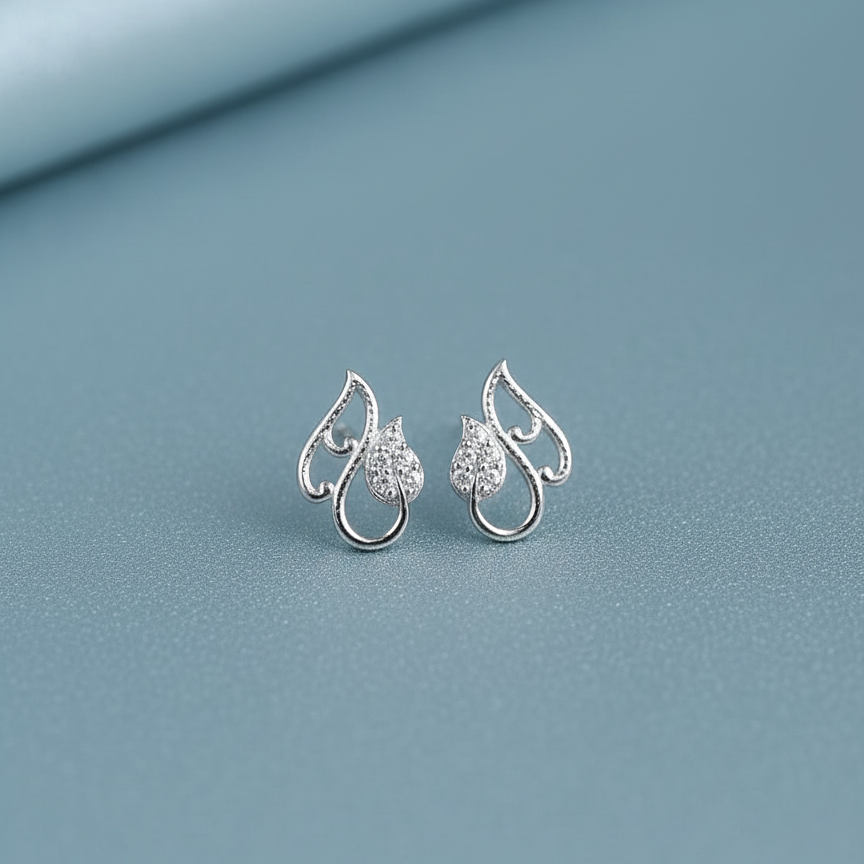 Pair of silver earrings with heart designs 