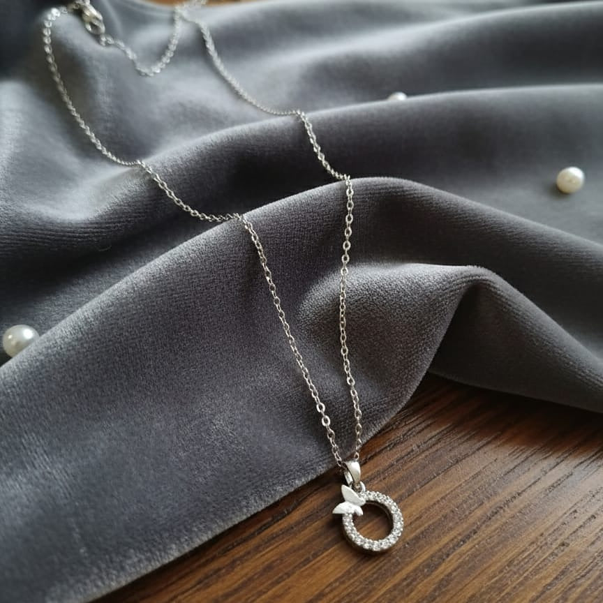 Silver necklace with a circular pendant 