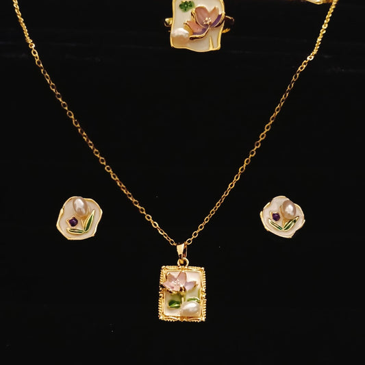 Gold necklace with pendant and matching earrings