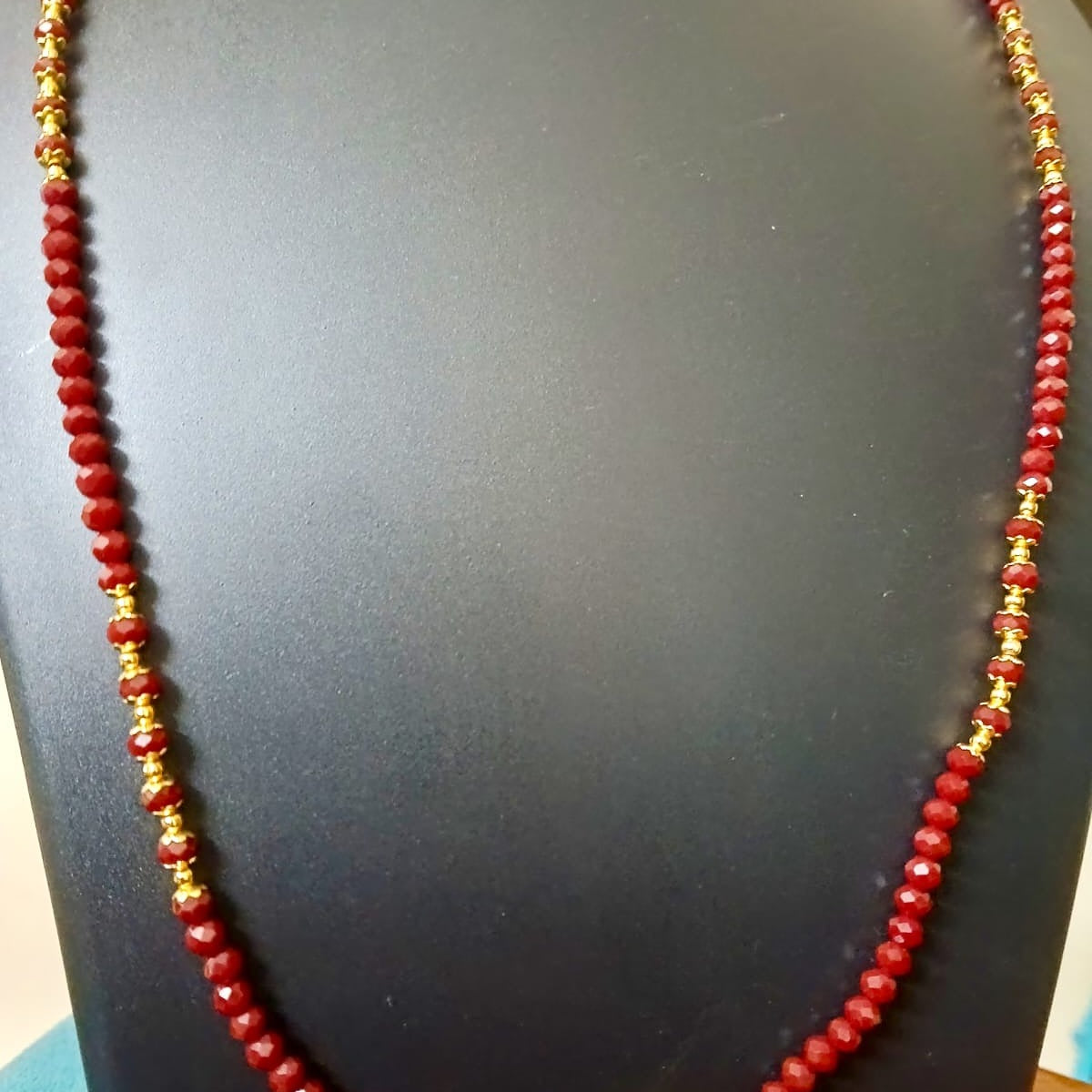 Red beaded necklace with gold accents 