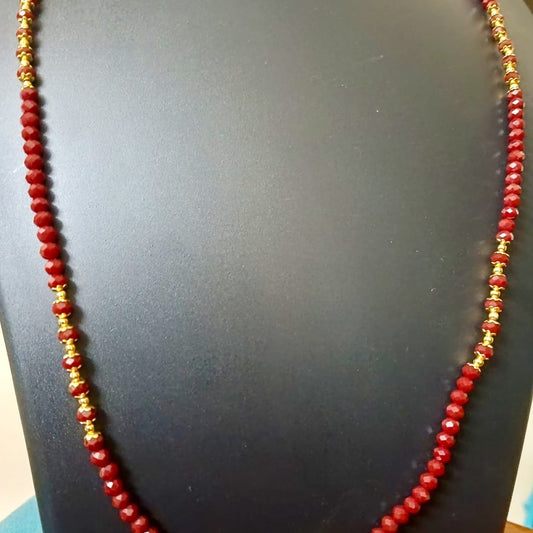 Red beaded necklace with gold accents 